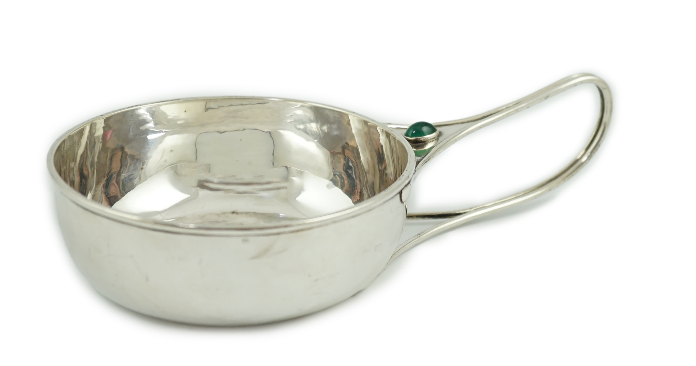 An Edwardian Arts & Crafts Charles Robert Ashbee for the Guild of Handicrafts Ltd silver and single stone cabochon chrysoprase set porringer